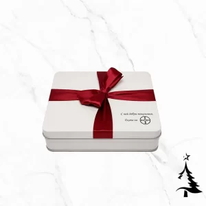 Red Ribbon Big фирмена бонбониера е бяла метална кутия, фабрично декорирана с червена панделка