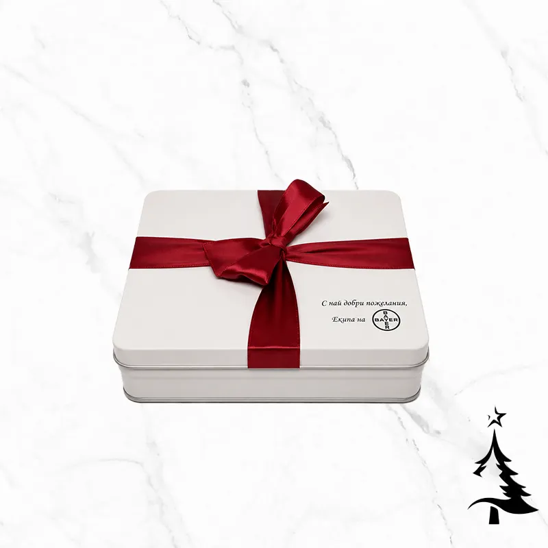 Red Ribbon Big фирмена бонбониера е бяла метална кутия, фабрично декорирана с червена панделка