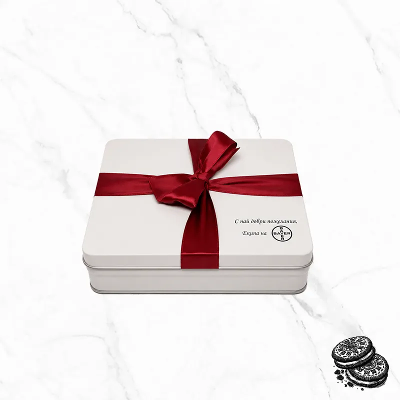 Red Ribbon Big фирмена бонбониера е бяла метална кутия, декорирана с червена панделка